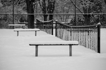 Empty tennis court covered with snow in the Stanley Park, Vancouver, Canada