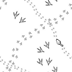Seamless background with bird's tracks. Monochrome hand drawn texture.