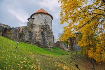 Fototapeta na wymiar City Cesis, Latvia Republic. Old castle and rocks, autumn. Historic architecture. 12. okt. 2019