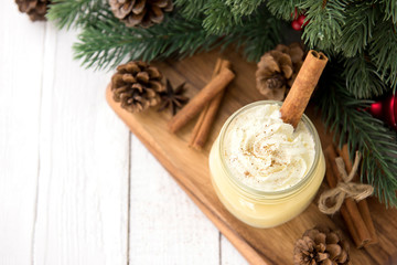 Traditional Christmas eggnog drink with whipped cream