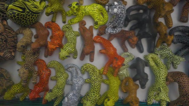 Clay jaguars painted with different colors. From Chapias, Mexico.