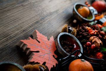Halloween theme. Decorations prepared for Halloween on the rustic wooden table. Place for text.