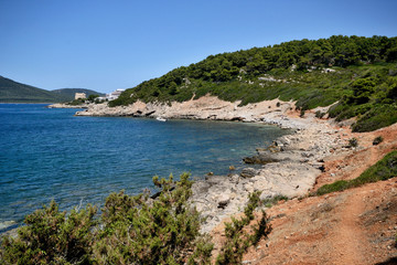 Fototapeta na wymiar Coast of mediterranean sea in Punta Giglio promontory of Porto Conte Natural Park near Alghero