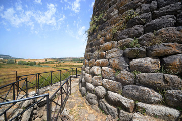 The central tower of basalt stone 17 meters high of the Nuraghe Santu Antine near Torralba, in the province of Sassari and the surrounding countryside