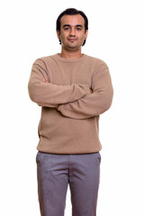 Portrait of Persian man wearing sweater with arms crossed