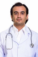 Face of Persian man doctor looking at camera