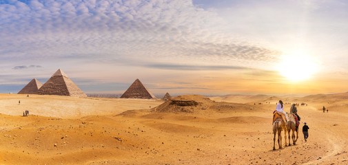 Famous Giza Pyramids in the desert, beautiful scenery with bedouins and camels, Cairo, Egypt - obrazy, fototapety, plakaty