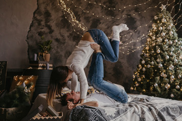 Romantic couple in love feeling happiness about their romance spending christmas eve together- Image