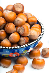 Hazelnuts in bowl  isolated on white background - Image