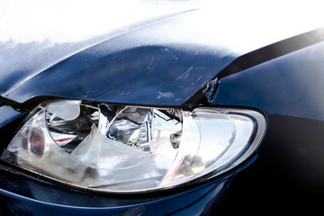 Fototapeta na wymiar Car collision crash at radiator bonnet cause head light and covered glass broken and bump.