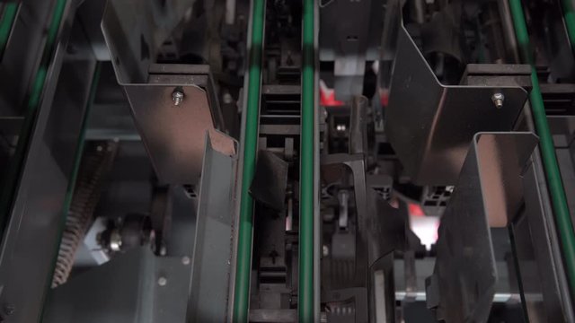 Bowling machine at play, prepares and puts pins on the pindeck for players