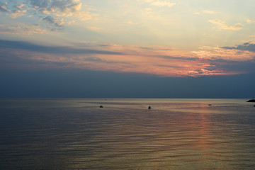 Sunrise over the sea in the early morning near the coast of Sicily, Italy
