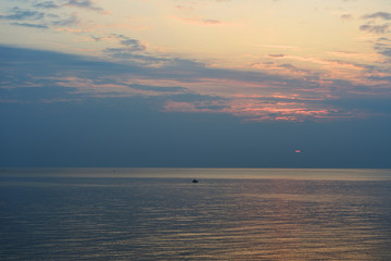 Sunrise over the sea in the early morning near the coast of Sicily, Italy
