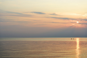 Obraz premium Sunrise over the sea in the early morning near the coast of Sicily, Italy