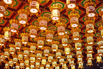 Chinatown/Singapore-Oct 13,2019 : Interior of lamps inside Buddha Tooth Relic Temple and Museum. A pattern golden Chinese lanterns roof background.