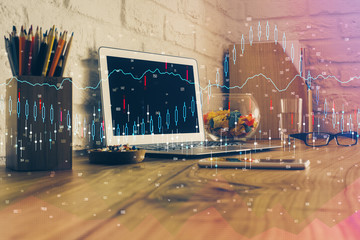 Double exposure of forex graph and work space with computer. Concept of international online trading.