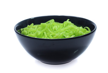 green noodles on bowl isolated on white background