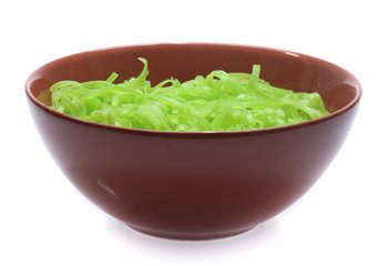 green noodles on bowl isolated on white background