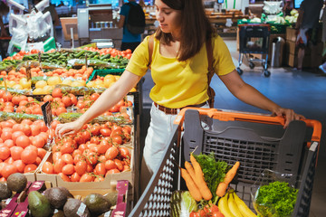 woman do shopping in city supermarket