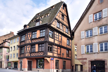 Fototapeta na wymiar Strasbourg, France - May 2019. Traditional half-timbered houses in the center old city Strasbourg. Amazing colorful houses in La Petite France, Alsace. Beautiful view of the historic town Strasbourg