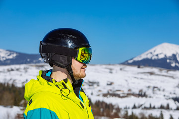 Fototapeta na wymiar man in helmet and ski mask. reflection. winter activity