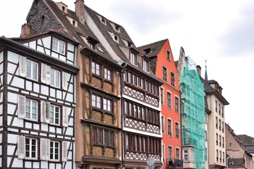 Fototapeta premium Strasbourg, France - May 2019. Traditional half-timbered houses in the center old city Strasbourg. Amazing colorful houses in La Petite France, Alsace. Beautiful view of the historic town Strasbourg