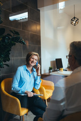 insurance agent in office with client