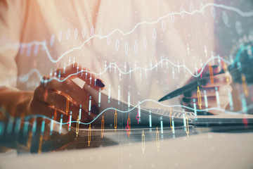 Financial chart drawn over hands taking notes background. Concept of research. Multi exposure