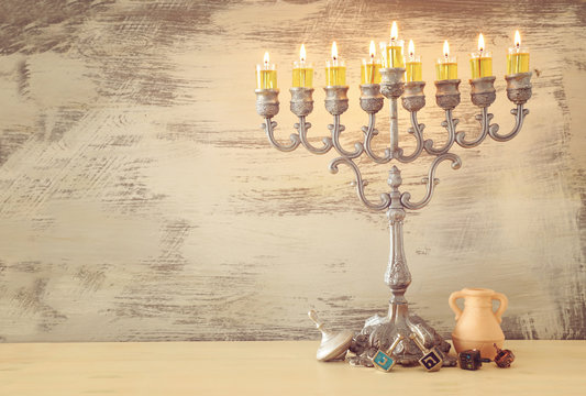 Religion image of jewish holiday Hanukkah background with menorah (traditional candelabra) and dreidels