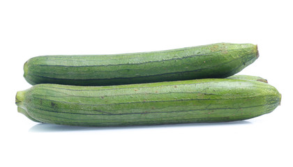 fresh green sponge gourd or luffa with slice isolated on white background