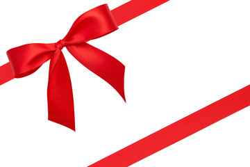 Top view on stunning beautiful bright simple perfect bow and two red diagonal silk ribbons with copy space isolated on white background.  Greeting, invitation, discount card or gift wrapping concept