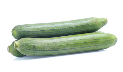 fresh green sponge gourd or luffa with slice isolated on white background