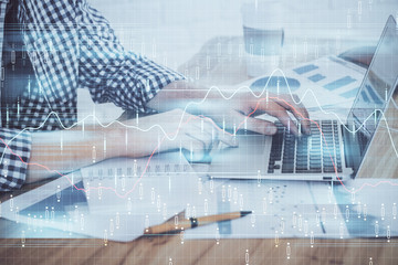 Multi exposure of stock market chart with man working on computer on background. Concept of financial analysis.