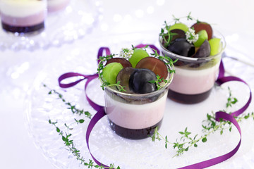 Homemade autumn glass desserts with grapes