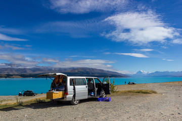 campervan with open doors on a campsiteat Lake Pukaki with Mt Cook as a Background, South Island New Zealand