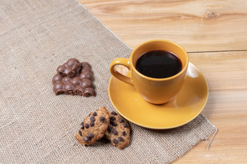 cup of coffee with homemade cookies chocolate sweets on wooden background baking aromatic beginning of the day