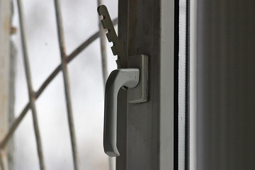 the handle and plastic stop opening the window