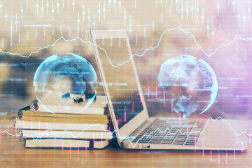 Financial chart drawing and table with computer on background. Double exposure. Concept of international markets.