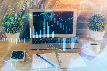 Multi exposure of graph and financial info and work space with computer background. Concept of...