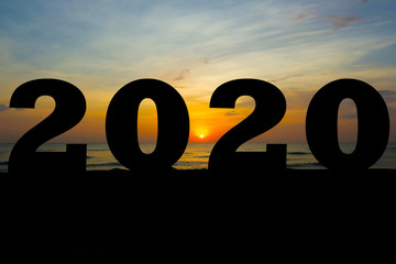 happy new year 2020 silhouette sunrise or sunset on background copy space