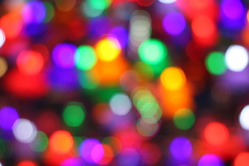 Blurry image of colorful bokeh at a decorating light during festival.