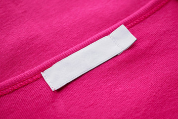 Blank white clothes tag label on new shirt