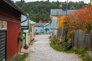 Fototapeta na wymiar Street of Old Porvoo, Finland. Beautiful city autumn landscape with colorful buildings.