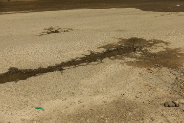 Due to technology of violations in construction of roads, Extreme cold and heavy rains washed away asphalt road and formed numerous cracks and dangerous failures