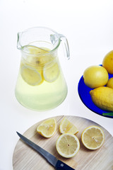 View of lemons cut to make lemonade on a white background