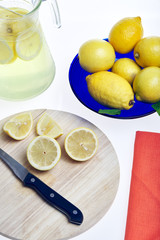 View of lemons cut to make lemonade on a white background