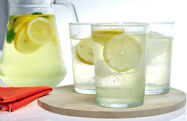 Group of glasses with lemonade on a white background