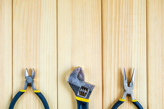 Tools for master builder and accessories on wooden background