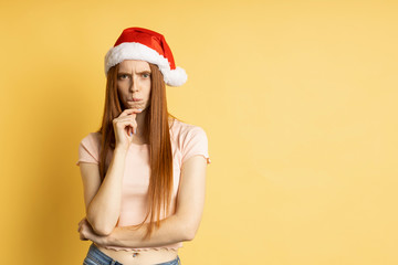 Beautiful caucasian female model wearing santa hat