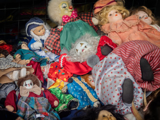 Worn out dolls puppets  on a flea market in Rome, Italy
